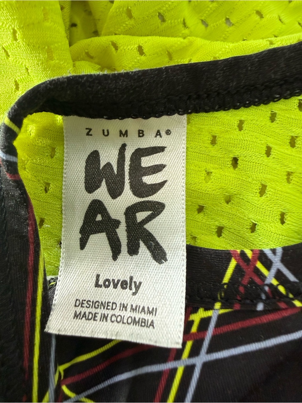 Zumba Fitness Neon Yellow Mesh Top with Black Trim and Multicolor Stripe Detail - Picture 10 of 13